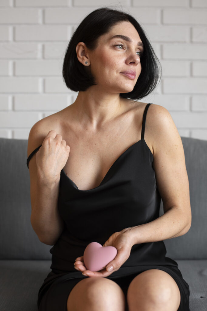 medium-shot-woman-posing-with-vibrator